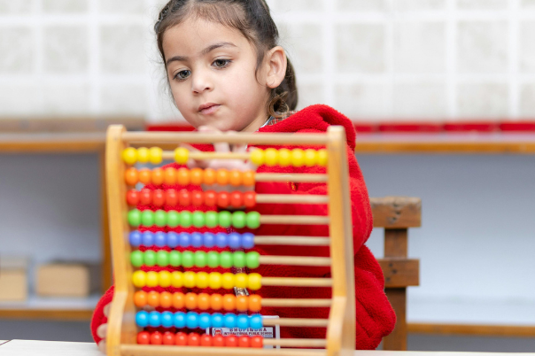 girl counting on abacus